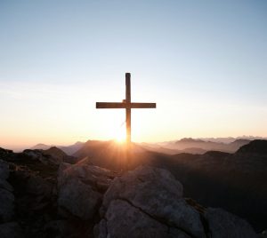 brown cross on brown rock during daytime